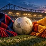 Футбольный мяч между красно-синим и желто-оранжевым шарфами на фоне стадиона — иллюстрация к матчу Лилль — Галатасарай
